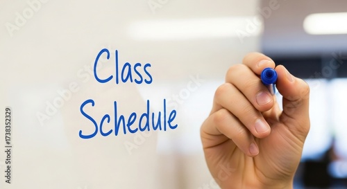 Hand Writing Class Schedule on Whiteboard marker