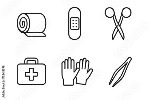 Basic first aid kit essentials: bandage, scissors, tweezers, gloves, and medical supplies