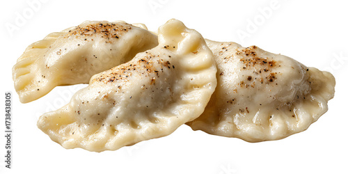 Delicious homemade pierogi dumplings with black pepper on a black background Traditional Polish cuisine, comfort food, and culinary delight