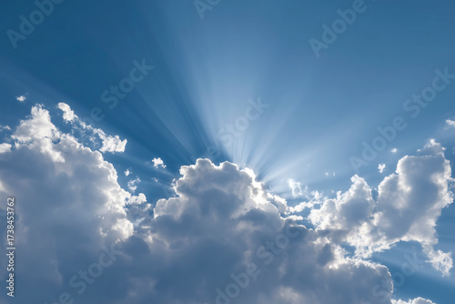 Sun rays breaking through clouds in the sky
