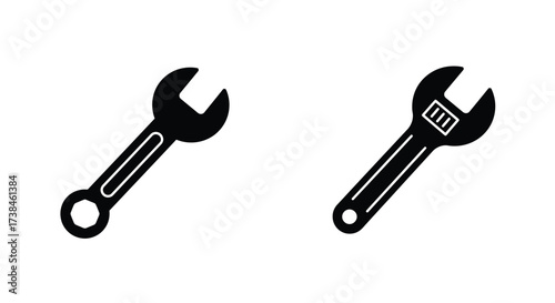 Two black wrench icons displayed on a plain white background