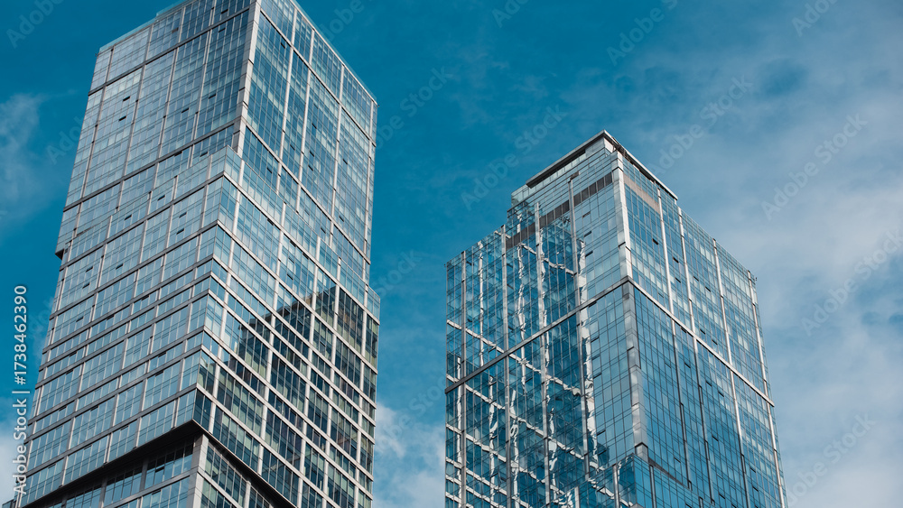 Fototapeta premium mirrored windows of the facade of an office building 