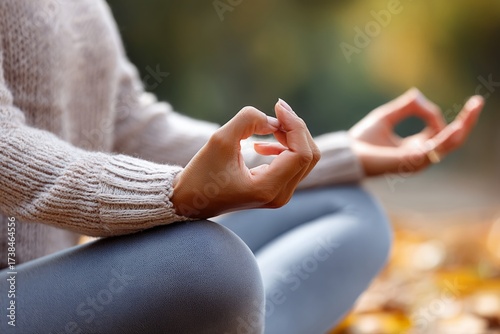 Wallpaper Mural Woman meditates outdoors, hands form mudra, peaceful mind, relaxation focus, natural light, soft autumn setting. Torontodigital.ca