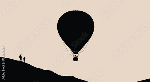 Silhouette of a hot air balloon ascending against a pale sky.