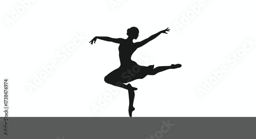 Silhouette of a graceful ballerina performing a dance pose on stage.