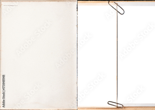 A vintage book pages with blank photo frames attached with paper clips.