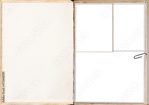 A vintage book pages with blank photo frames attached with paper clips.
