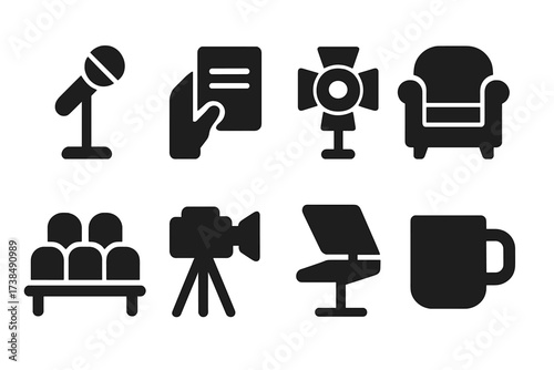 Talk Show Icons. Solid, filled icon set of talk show host features: microphone stand, cue card, spotlight, guest chair, audience seats, camera, teleprompter,
