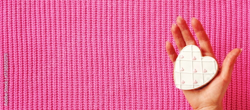 Heart Cookie Sweet Romantic Handheld Flatlay Pink Background Minimal Concept. White Biscuit Shaped Love Symbol Human Touch Top View Bright Style