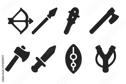 Tribal Weapons Icons. Solid, filled icon set of tribal weapons: bow, spear, club, blowgun, axe, dagger, shield, slingshot. Solid, filled icons in only black