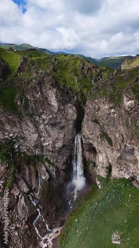 Flying over the Jily-Su Waterfall in the Caucasus in the summer