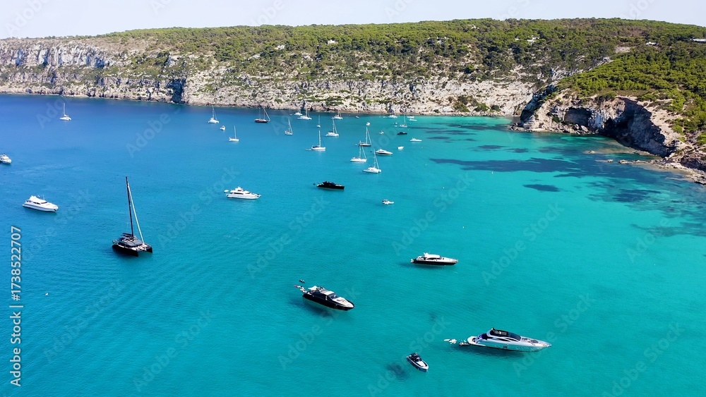 Obraz premium Aerial view of the anchorage for yachts, on the island of Formentera, Spain, and the area called En Caló.