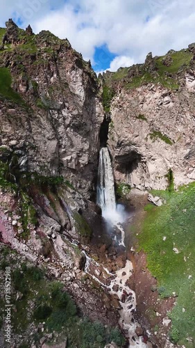Flying over the Jily-Su Waterfall in the Caucasus in the summer