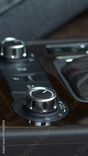 Turning the thumbturn in modern cars. female hand adjusts the thumbturn in the car