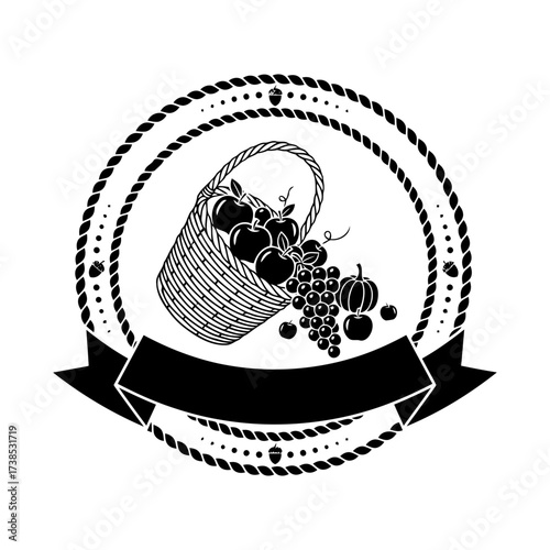 Vector art of a rustic black and white illustration of a woven basket overflowing with apples, grapes, and pumpkins, spilling out onto a surface, set within a circular rope border and a banner