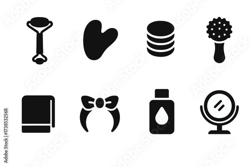 Beauty Toolkit Icons. Solid, filled icon set of cream related beauty tools: facial roller, gua sha, cotton pads, cleansing brush, towel, headband, makeup