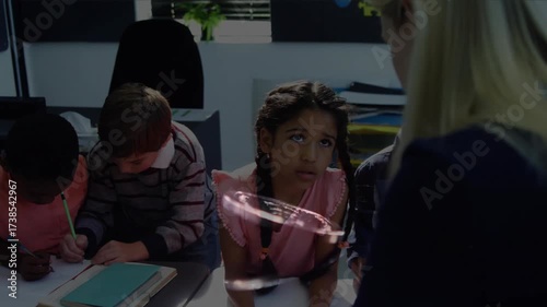 Wallpaper Mural Child pausing looking up causing teacher moving closer pointing paper and guiding drawing lesson Torontodigital.ca