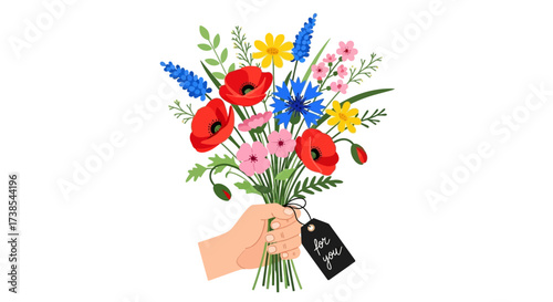 A Hand Holding a Vibrant Bouquet of Wildflowers Decorated with a Tag for a Special Occasion
