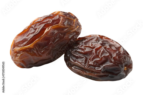 Wallpaper Mural Two wrinkled brown dates on a black background close up dried fruit Torontodigital.ca