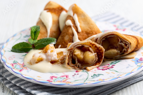 Thin pancakes with apple filling.