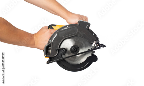 Wallpaper Mural A powerful electric hand-held circular saw in a man's hands, isolated on a white background, close-up. Woodworking tool, industry Torontodigital.ca