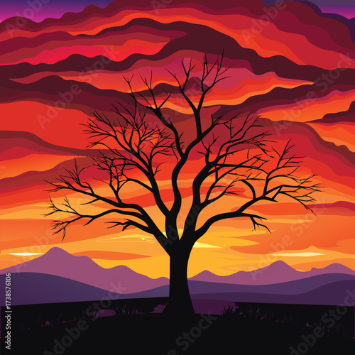 Silhouette of a bare tree against a dramatic fiery sunset sky