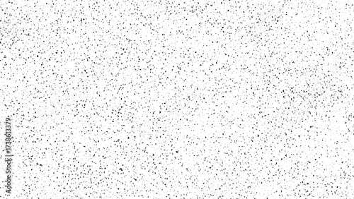 Black and white stipple dot grain texture overlay for grunge effect or abstract background. Halftone noise pattern for graphic design.