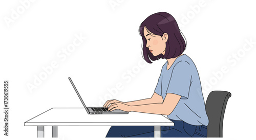 Woman typing on laptop at desk in casual attire