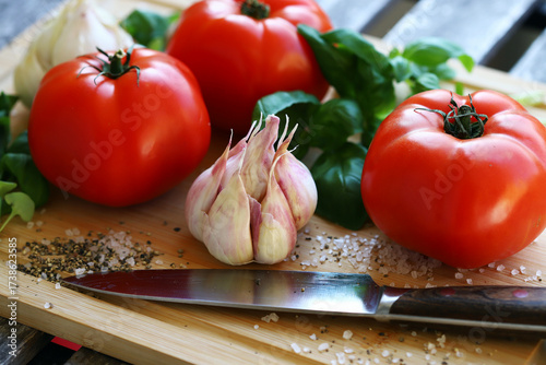 large tomatoes with basil and garlic