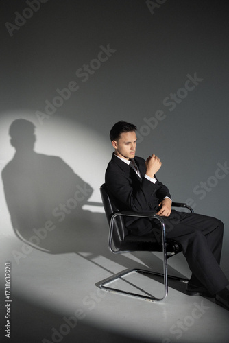 businessman sitting on chair 