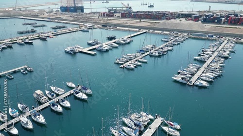 Aerial drone view of Marina Valencia with boats, yachts and waterfront cityscape
