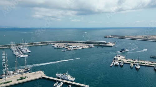 Aerial drone view of Marina Valencia with boats, yachts and waterfront cityscape