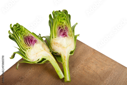 Half sliced fresh raw artichokes isolated on white background.