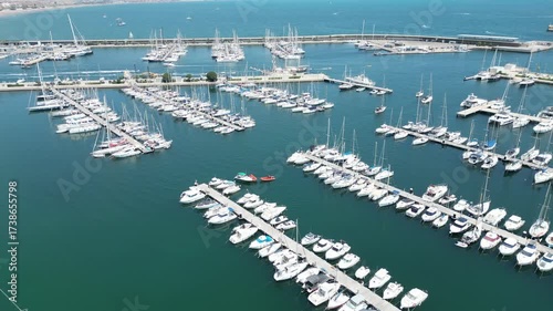 Drone footage of Valencia Marina featuring a panoramic view of yachts, boats, and the Mediterranean waterfront