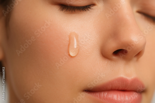 Collagen boost serum drop skincare glowing skin hydrating face closeup facial care moisturizer routine