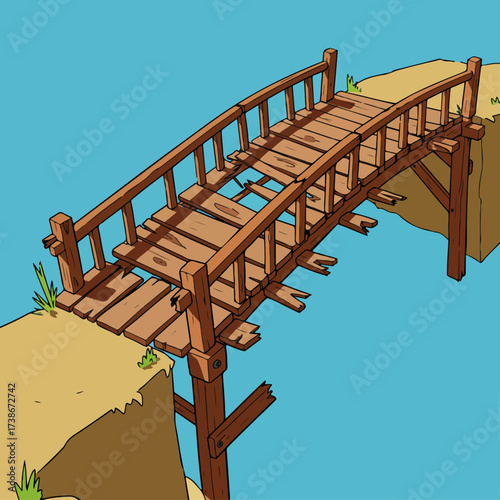An old, dilapidated wooden bridge spans a gap between two sandy cliffs under a clear blue sky.