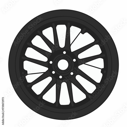 A black alloy wheel with a complex spoke design, featuring a central hub and tire.