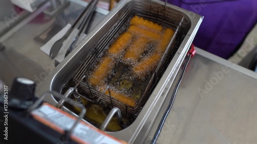 frying churros in an electric fryer