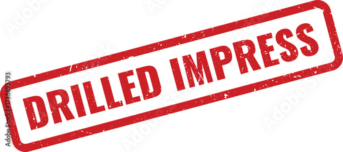 Red Drilled Impress Rubber Stamp on White Background, Indicating a Precise or Deeply Applied Mark
