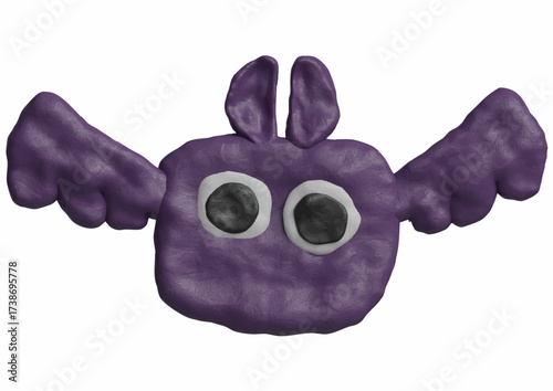Purple clay figure of a bat with large eyes and spread wings, isolated on a white background.