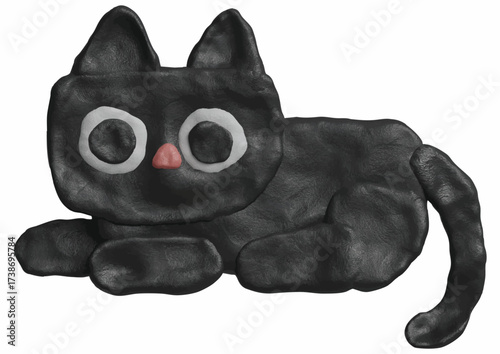 A stylized black cat figurine made from clay, resting and looking forward.