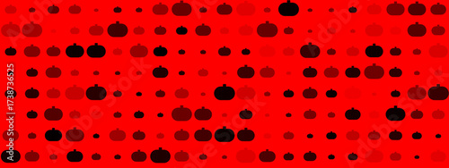 Abstract pattern of varying sized pumpkins in shades of red and black on a vibrant red background, perfect for Halloween or autumn designs.