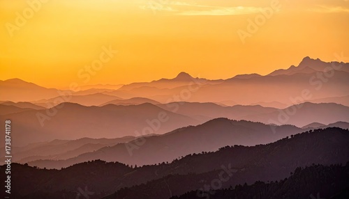 Wallpaper Mural Layered Mountain Range at Golden Sunset with Hazy Silhouette and Warm Colors a Horizontal Scenery in Shades of Orange Purple and Dark Blue Torontodigital.ca