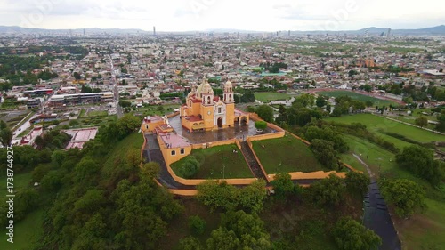 Cholula, Puebla, Mexico, aerial view of the Remedios Church on the top of the great pyramid, Popocatepetl volcano at the background