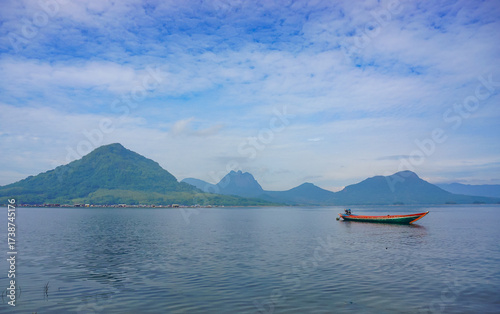 Colorful Wooden Boats Docked on a Lake with Mountain Background. Jatiluhur reservoir of Purwakarta. 