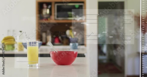 Upon playback overlays sliding flickering visualizing metrics over red bowl with spoon and juice