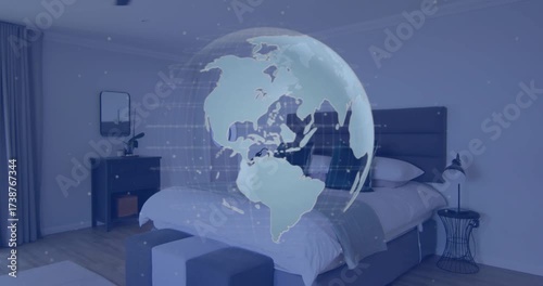 Static camera showing bedroom, transparent globe rotating eastward, reversing, revealing continents