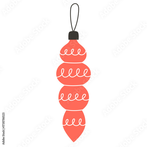 Festive coral ornament with white swirled details hanging from a black loop