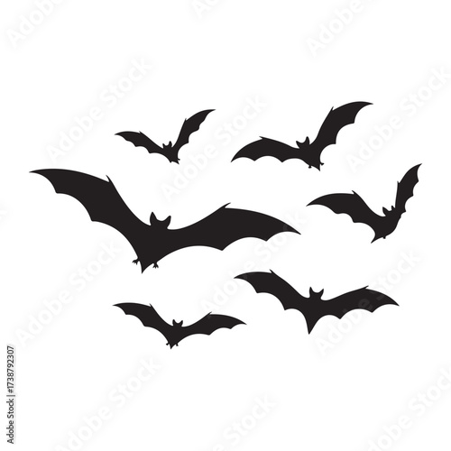 A flock of silhouetted bats in various flying poses against a stark white background creating a spooky halloween atmosphere
