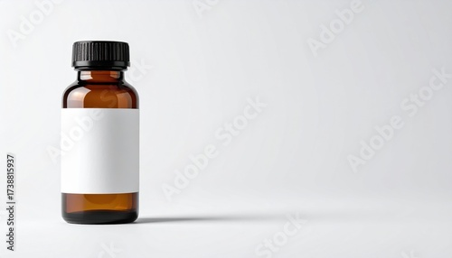 Amber glass bottle with blank label ready for your branding, perfect for essential oils, medicine, or cosmetic product mockups in clean, modern style